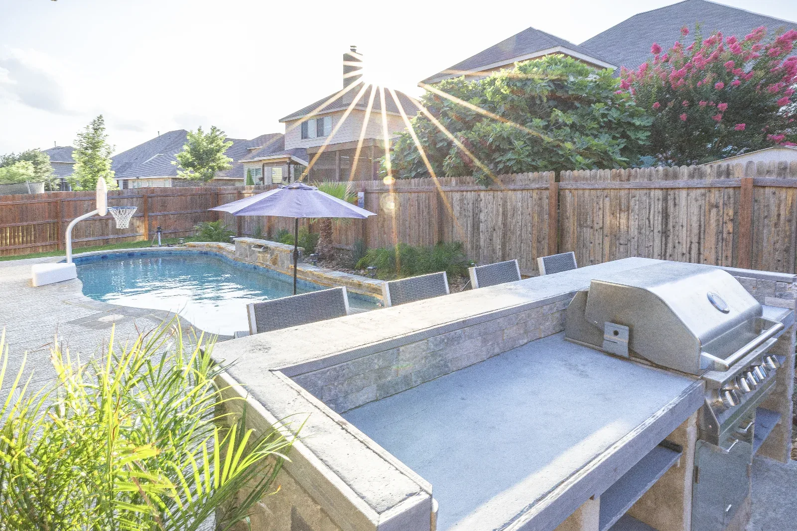 Grill and pool at Downwind Beach House- Randolph AFB Lodging